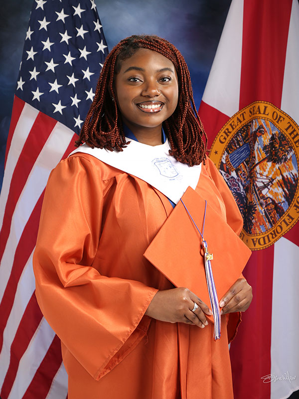 taylor in cap and gown